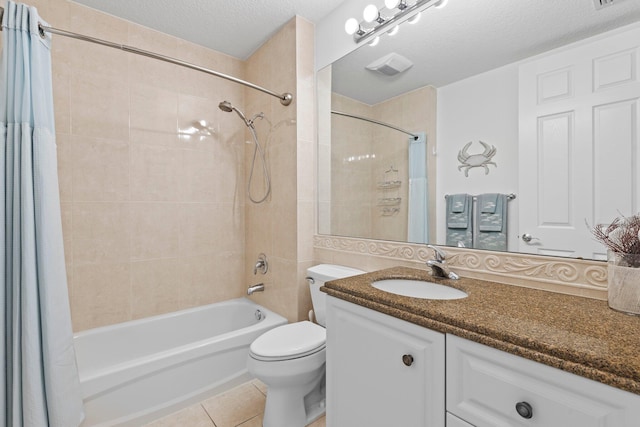 full bathroom with shower / bath combination with curtain, vanity, toilet, tile patterned floors, and a textured ceiling