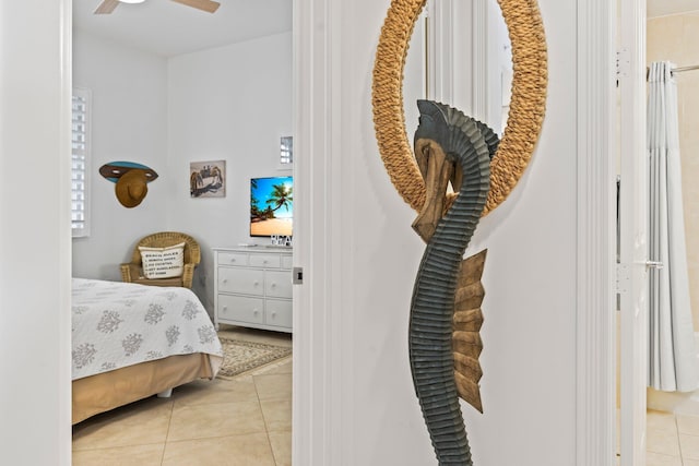 bedroom with light tile patterned floors and ceiling fan