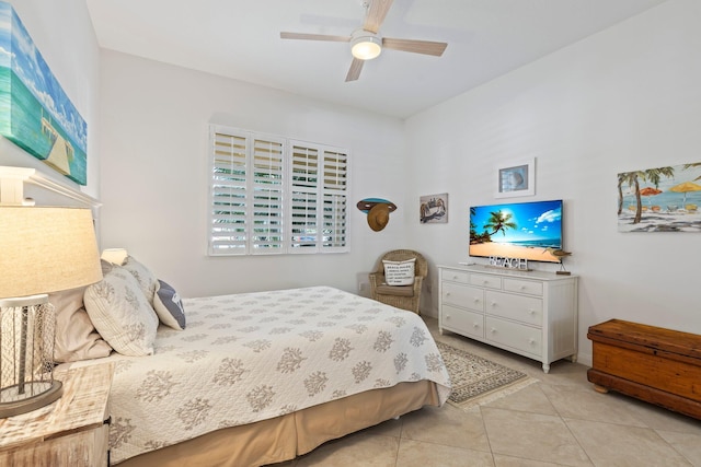 tiled bedroom featuring ceiling fan