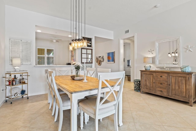 dining room featuring ceiling fan and light tile patterned floors