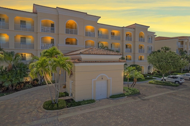 view of outdoor building at dusk