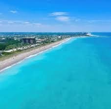 aerial view with a beach view and a water view