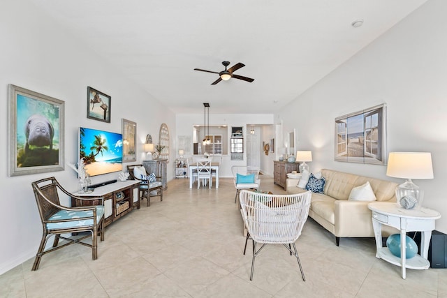 tiled living room featuring ceiling fan