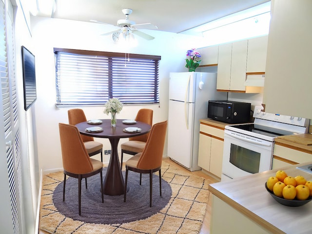 kitchen featuring ceiling fan, under cabinet range hood, white appliances, white cabinets, and light countertops