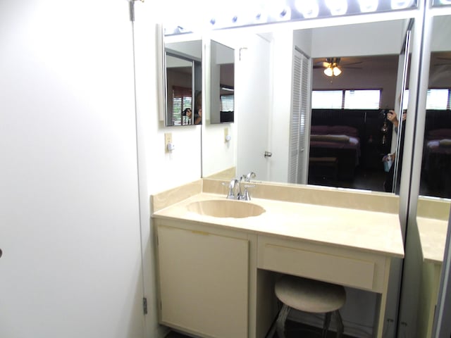 bathroom featuring ceiling fan and vanity