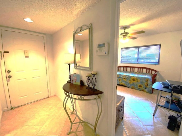 15451 Pembridge Dr Unit 217, Delray Beach, FL 33484 - interior space featuring light tile patterned flooring, a textured ceiling, and recessed lighting