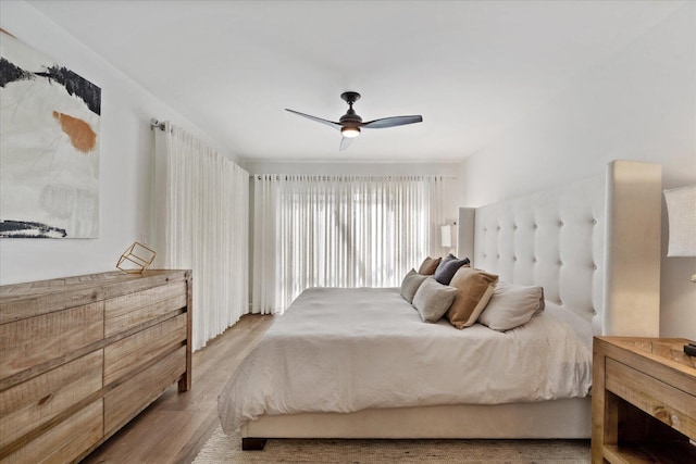 bedroom featuring wood-type flooring and ceiling fan