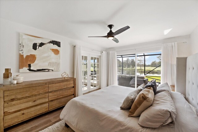 bedroom with hardwood / wood-style flooring, ceiling fan, french doors, and access to exterior