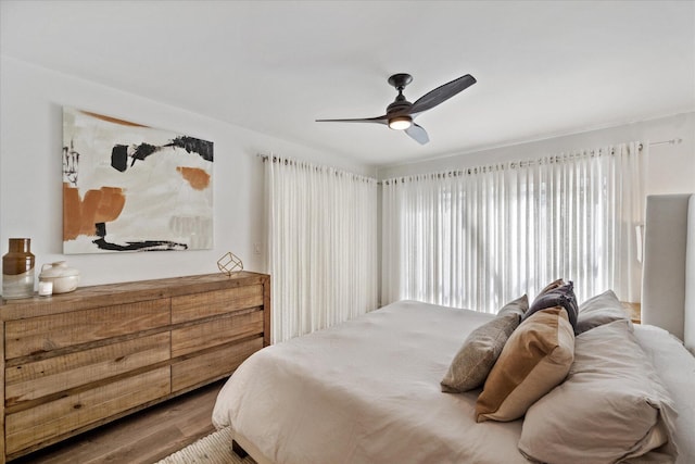 bedroom featuring ceiling fan and hardwood / wood-style flooring