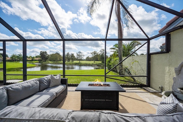 sunroom / solarium with a water view