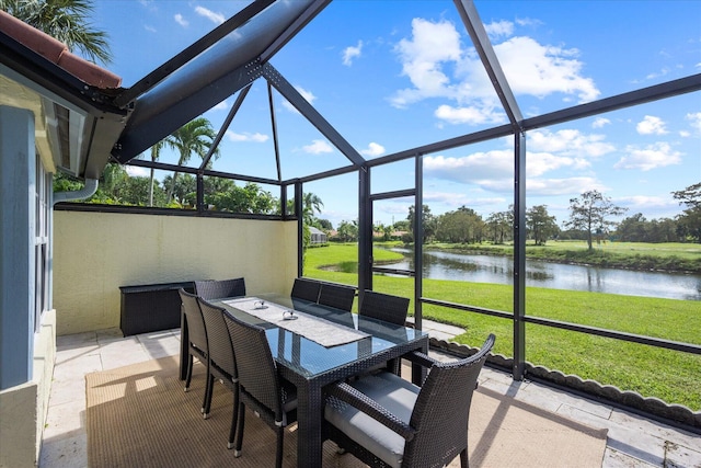 sunroom / solarium with a water view