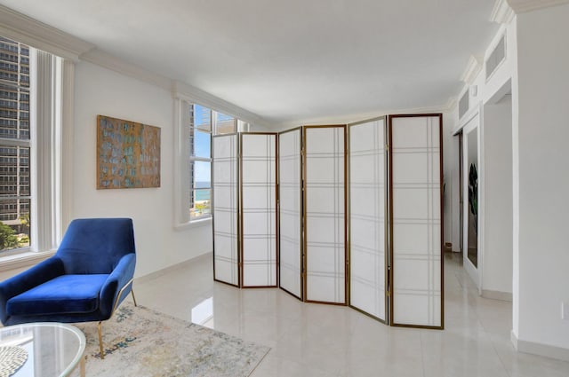 sitting room with ornamental molding