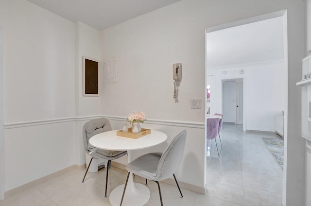 tiled dining area featuring electric panel