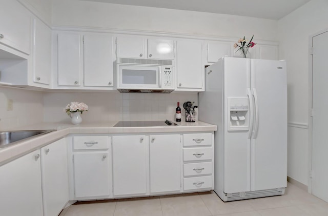 kitchen with tasteful backsplash, white cabinetry, sink, and white appliances