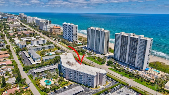 bird's eye view with a beach view and a water view