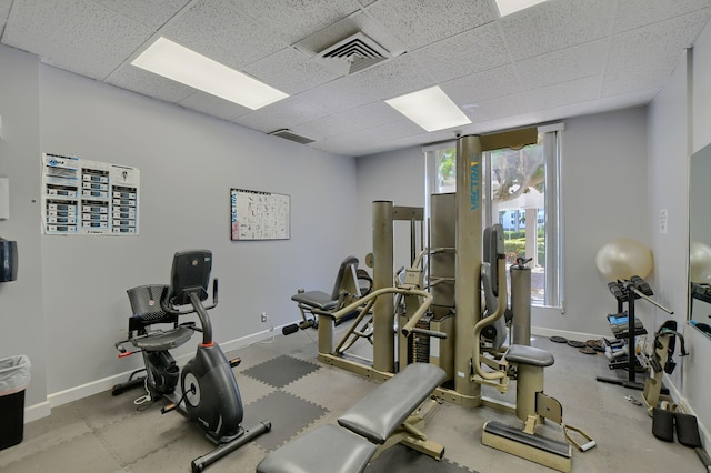 workout area with a paneled ceiling