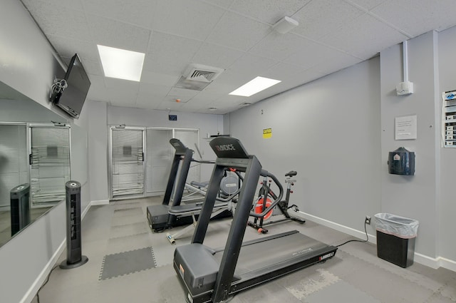 exercise area featuring a paneled ceiling