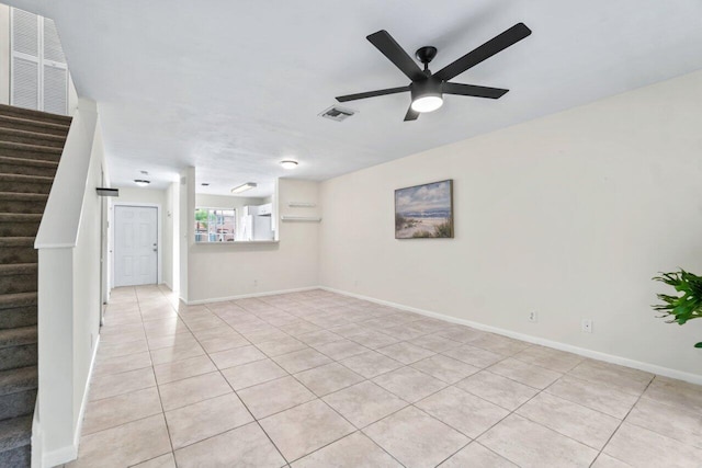 unfurnished room with ceiling fan and light tile patterned floors