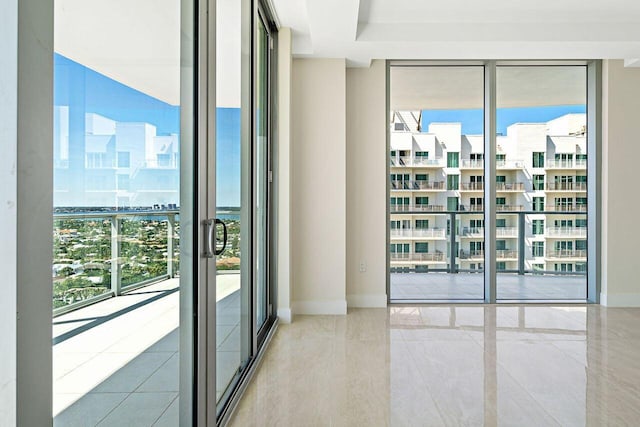 tiled spare room with floor to ceiling windows