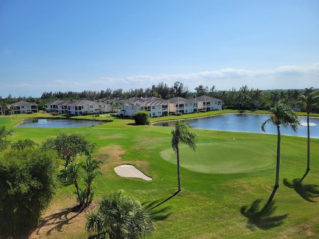 surrounding community featuring a yard and a water view