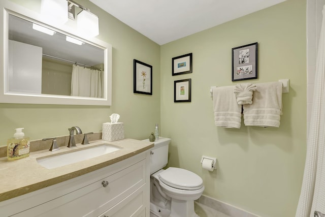 bathroom featuring curtained shower, toilet, and vanity