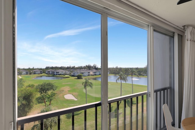 unfurnished sunroom with a water view