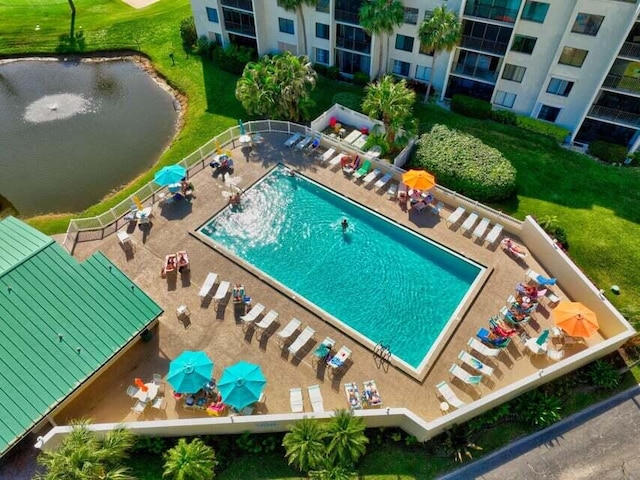 birds eye view of property with a water view