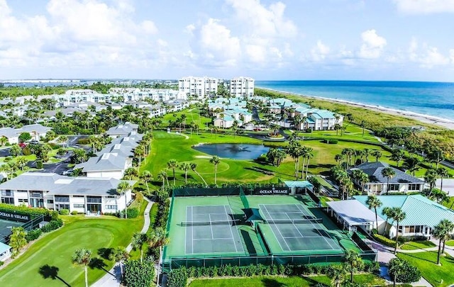 aerial view with view of golf course and a water view