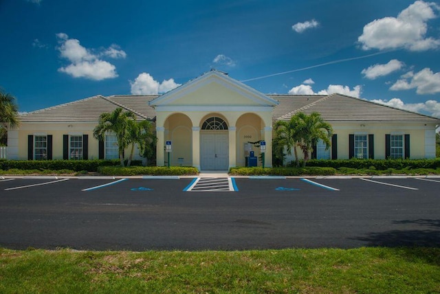 view of building exterior featuring uncovered parking