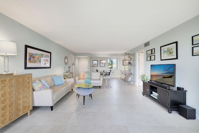 living room with light tile patterned floors