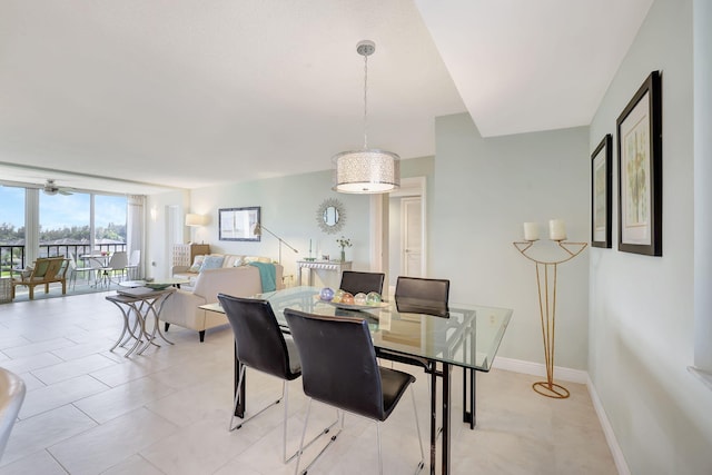 dining area with ceiling fan and light tile patterned floors