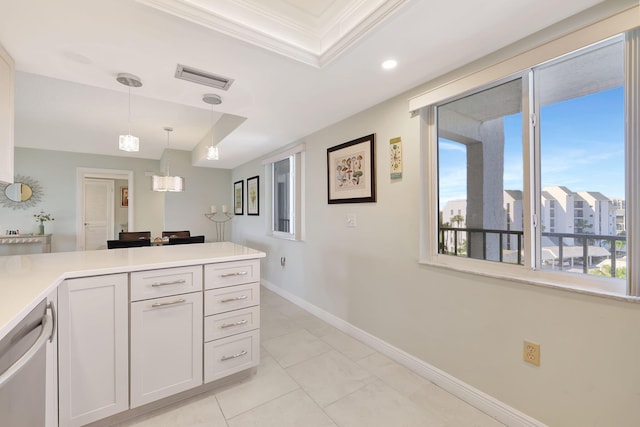 kitchen with stainless steel dishwasher, white cabinetry, a healthy amount of sunlight, and decorative light fixtures