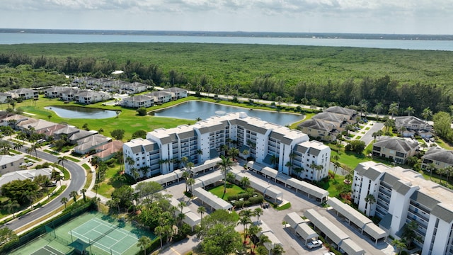 birds eye view of property with a water view