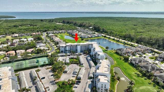 birds eye view of property with a water view and a residential view