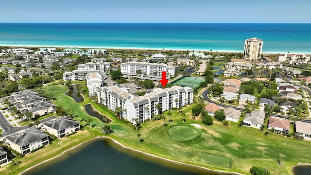 bird's eye view featuring a view of city, view of golf course, and a water view