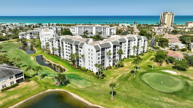 aerial view featuring view of golf course and a water view