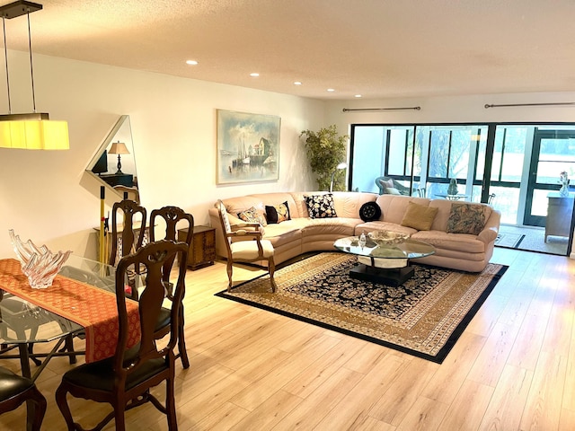 23 Westgate Ln Unit E, Boynton Beach, FL 33436 - living area featuring light wood-style flooring and recessed lighting