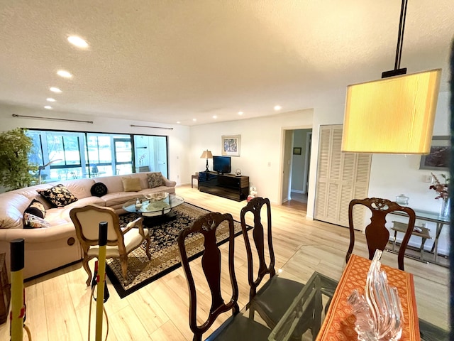 23 Westgate Ln Unit E, Boynton Beach, FL 33436 - living area with light wood-style flooring, recessed lighting, and a textured ceiling