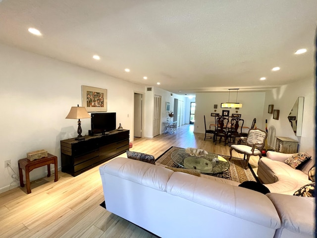23 Westgate Ln Unit E, Boynton Beach, FL 33436 - living area with light wood-style flooring, recessed lighting, and baseboards
