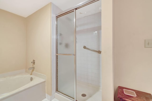 23 Westgate Ln Unit E, Boynton Beach, FL 33436 - bathroom with a stall shower and a garden tub