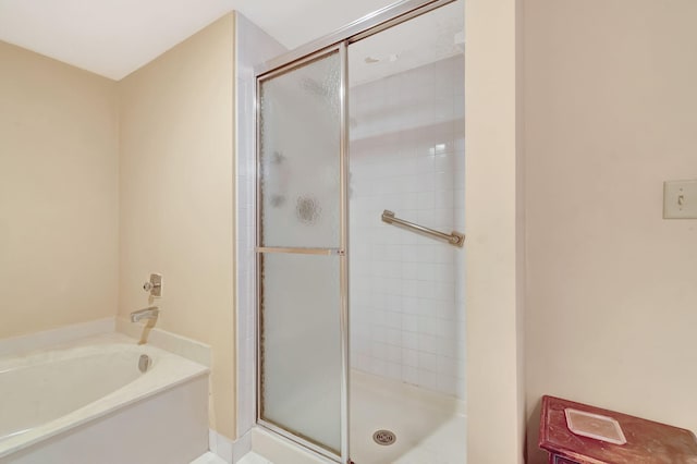 bathroom with separate shower and tub