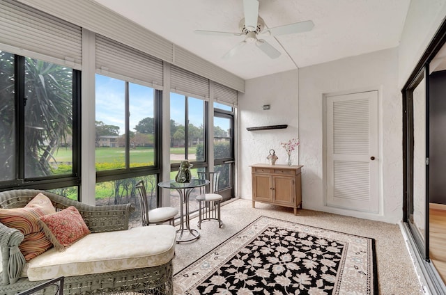 sunroom featuring plenty of natural light and ceiling fan