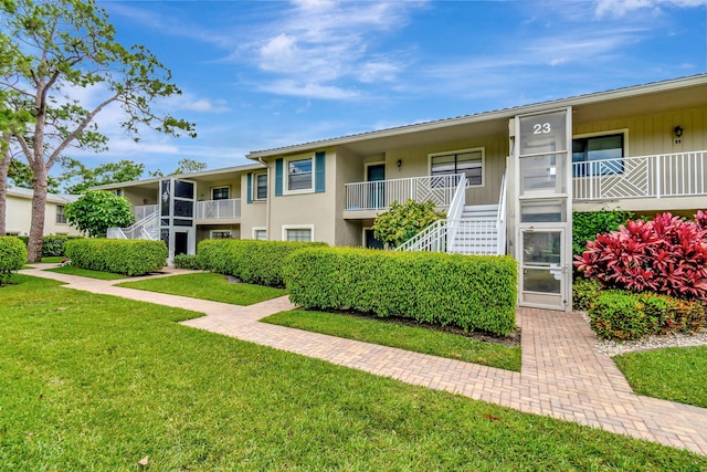23 Westgate Ln Unit E, Boynton Beach, FL 33436 - view of property with stairway