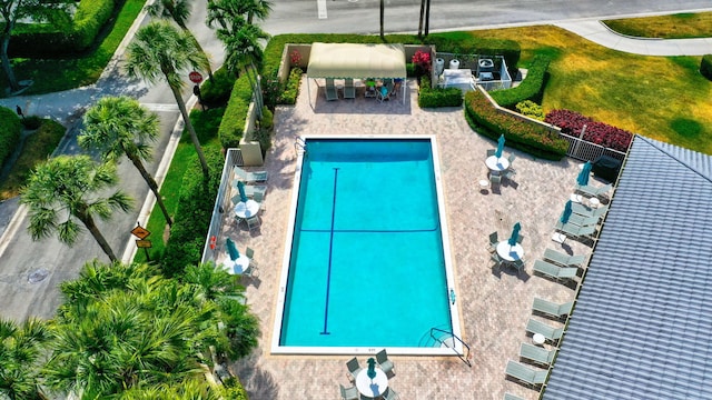 view of swimming pool with a patio