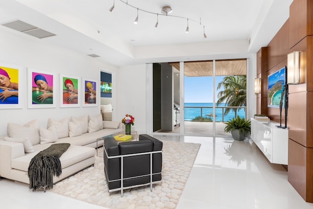 living room with a water view and track lighting