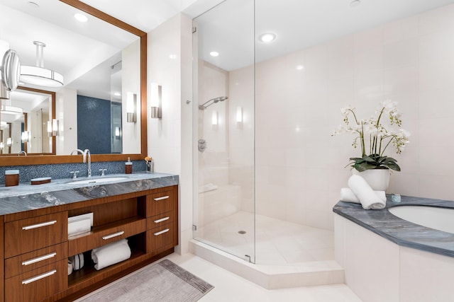 bathroom featuring an enclosed shower, oversized vanity, and tile flooring