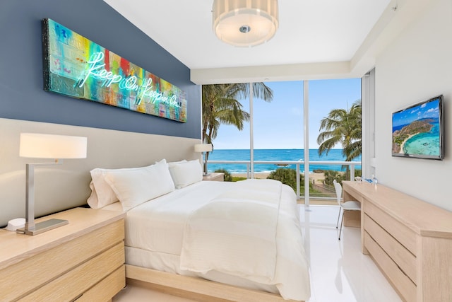 bedroom featuring a water view