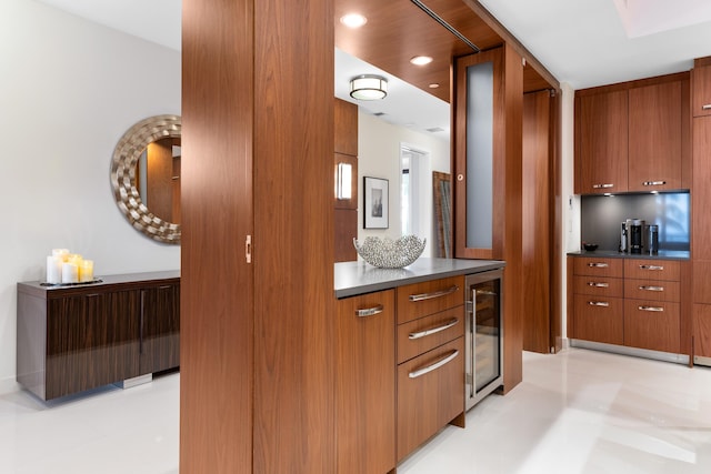 kitchen featuring light tile floors and beverage cooler