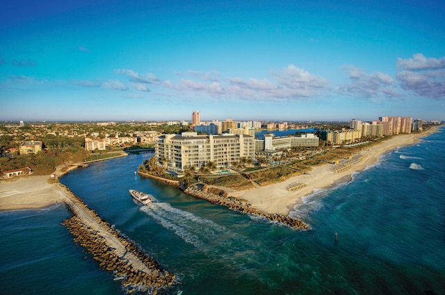 drone / aerial view with a water view and a view of the beach