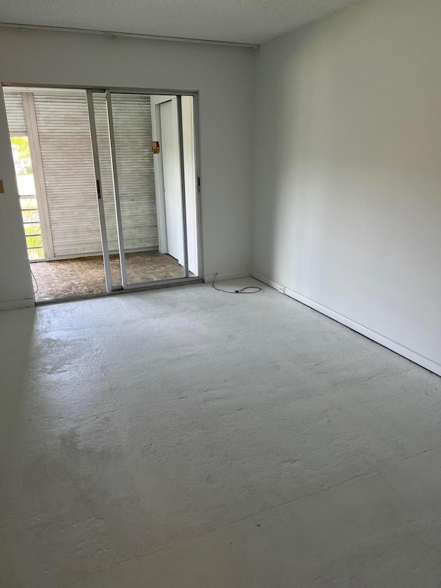 unfurnished bedroom featuring a closet and a textured ceiling